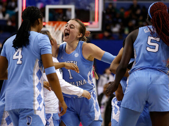 GREENSBORO, NORTH CAROLINA - MARCH 7: Alyssa Ustby #1 of the North Carolina Tar Heels celebrates with teammates following their win against the Florida State Seminoles in a quarterfinals game of the ACC women's basketball tournament at First Horizon Coliseum on March 7, 2025 in Greensboro, North Carolina.