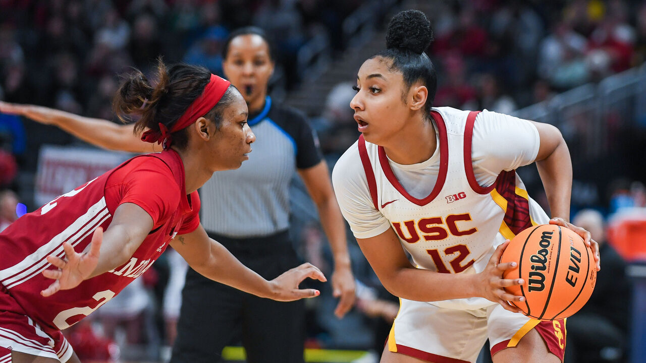 INDIANAPOLIS, INDIANA - MARCH 07: JuJu Watkins #12 of the USC Trojans looks to make a play against Chloe Moore-McNeil #22 of the Indiana Hoosiers during the second half of the quarterfinal round of the Big Ten Women’s Basketball Tournament against at Gainbridge Fieldhouse on March 07, 2025 in Indianapolis, Indiana. The USC Trojans won the game 84-79.