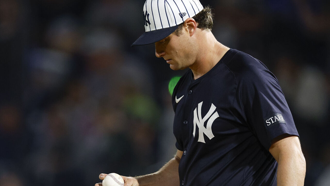 TAMPA, FLORIDA - FEBRUARY 28: Gerrit Cole #45 of the New York Yankees inspects a baseball in the third inning during a spring training game against the Toronto Blue Jays at George M. Steinbrenner Field on February 28, 2025 in Tampa, Florida.