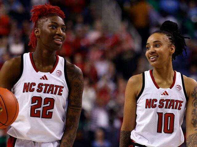 GREENSBORO, NORTH CAROLINA - MARCH 8: Saniya Rivers #22 and Aziaha James #10 of the NC State Wolfpack celebrate as time expires against the North Carolina Tar Heels in a semifinal game of the ACC women's basketball tournament at First Horizon Coliseum on March 8, 2025 in Greensboro, North Carolina.