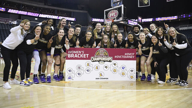 EVANSVILLE, IN - MARCH 08: The Tennessee Tech Golden Eagles pose for a photo after sticking their logo on the 2025 Champion circle on the OVC bracket after winning the Ohio Valley Conference Women's Basketball Tournament championship game between the Tennessee Tech Golden Eagles and the Lindenwood Lions on March 8, 2025, at the Ford Center in Evansville, Indiana.