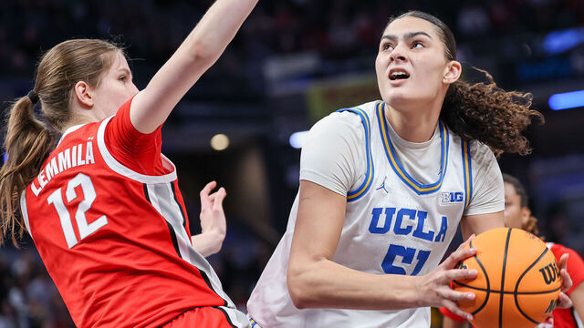 INDIANAPOLIS, INDIANA - MARCH 8: Lauren Betts #51 of the UCLA Bruins looks to shoot the ball against Elsa Lemmila #12 of the Ohio State Buckeyes during the second half in the Big Ten Women's Basketball Tournament semifinals at Gainbridge Fieldhouse on March 8, 2025 in Indianapolis, Indiana.