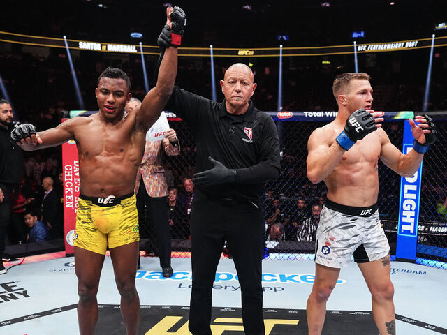 LAS VEGAS, NEVADA - MARCH 08: (L-R) Mairon Santos of Brazil and Francis Marshall react to the decision in a featherweight fight during the UFC 313 event at T-Mobile Arena on March 08, 2025 in Las Vegas, Nevada.