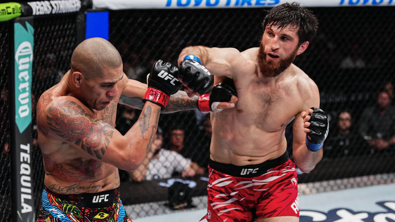 LAS VEGAS, NEVADA - MARCH 08: (R-L) Magomed Ankalaev of Russia strikes Alex Pereira of Brazil in the UFC light heavyweight championship fight during the UFC 313 event at T-Mobile Arena on March 08, 2025 in Las Vegas, Nevada.