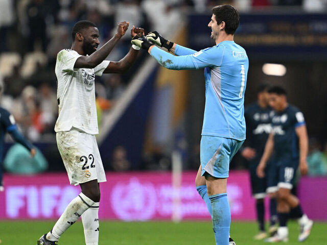 Real Madrid's Belgian goalkeeper #1 Thibaut Courtois and German defender #22 Antonio Ruediger celebrate at the end of the 2024 FIFA Intercontinental Cup final football match between Spain's Real Madrid and Mexico's Pachuca at the Lusail Stadium in Doha on December 18, 2024.