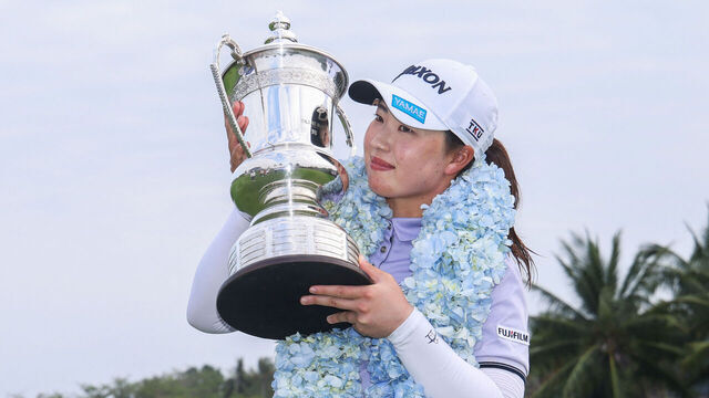 Japan's Rio Takeda holds the trophy after winning the LPGA Blue Bay golf tournament at the Jian Lake Blue Bay Golf Club in Lingshui, on China's southern Hainan island on March 9, 2025.