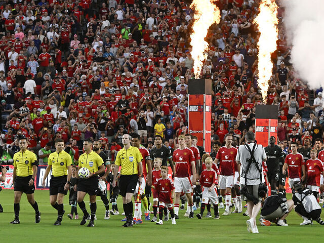 Players and referees enter the picth before the start of the pre-season club friendly football match between Manchester United and Liverpool at Williams-Brice Stadium in Columbia, South Carolina, August 3, 2024.