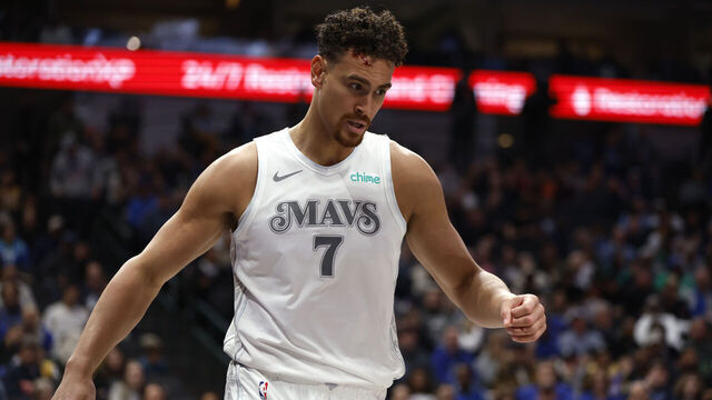 DALLAS, TX - MARCH 09: Dwight Powell #7 of the Dallas Mavericks reacts after colliding with a teammate against the Phoenix Suns during the second half at American Airlines Center on March 9, 2025 in Dallas, Texas.