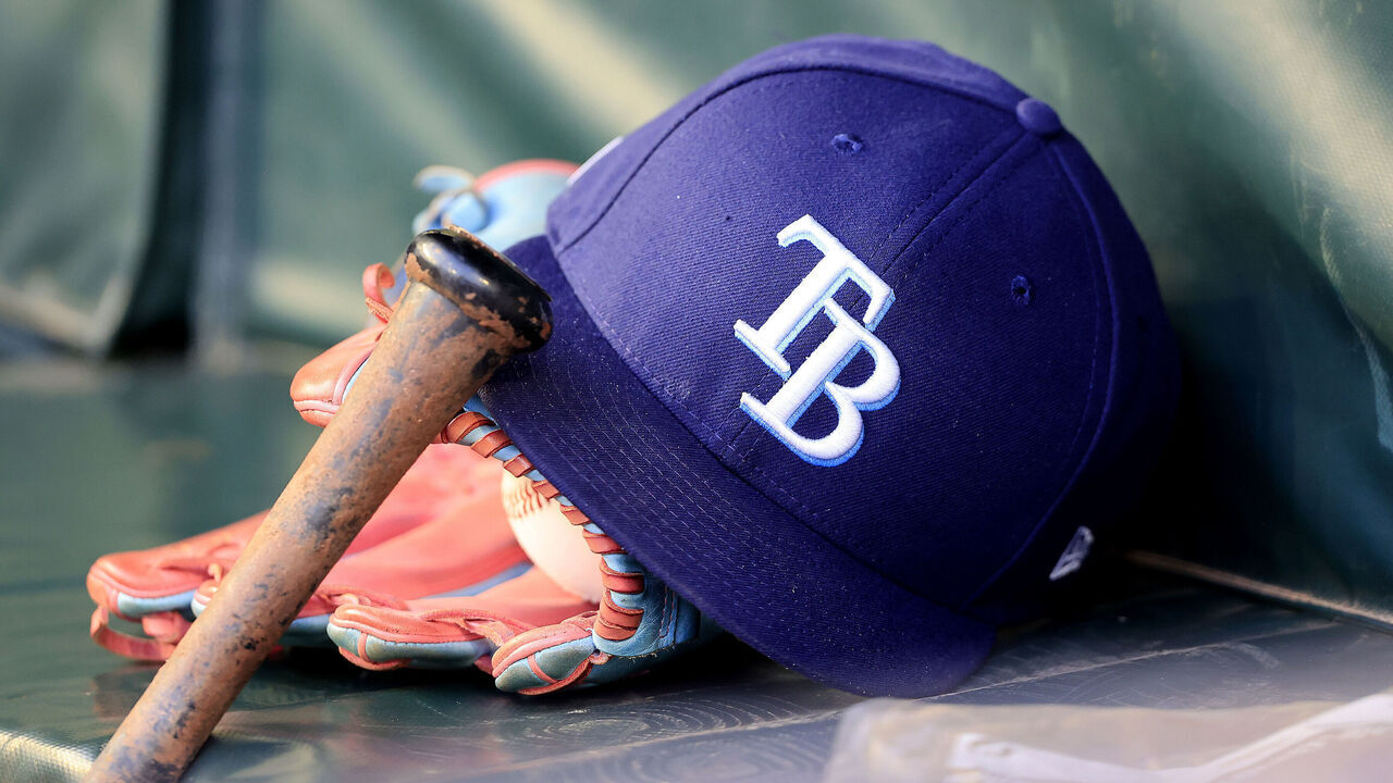 ATLANTA, GA - JUNE 14:A Tampa Bay Rays ball cap, mitt and bat in the dugout during the Friday evening MLB game between the Atlanta Braves and the Tampa Bay Rays on June 14, 2024 at Truist Park in Atlanta, Georgia.