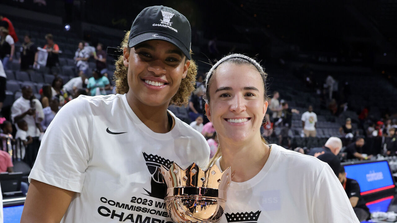 LAS VEGAS, NEVADA - AUGUST 15: Nyara Sabally (L) #8 and Sabrina Ionescu #20 of the New York Liberty hold the championship trophy after the team's 82-63 victory over the Las Vegas Aces in the 2023 Commissioner's Cup Championship game at Michelob ULTRA Arena on August 15, 2023 in Las Vegas, Nevada.