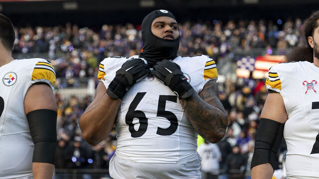 BALTIMORE, MARYLAND - DECEMBER 21: Dan Moore Jr. #65 of the Pittsburgh Steelers looks on during the national anthem prior to an NFL Football game against the Baltimore Ravens at M&T Bank Stadium on December 21, 2024 in Baltimore, Maryland.