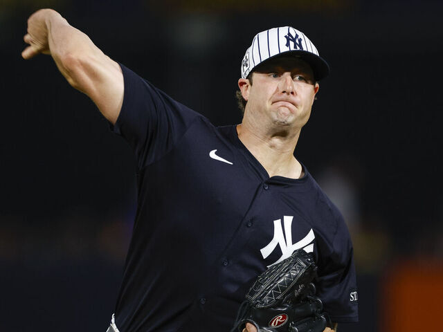 TAMPA, FLORIDA - FEBRUARY 28: Gerrit Cole #45 of the New York Yankees throws a warm up pitch in the second inning during a spring training game against the Toronto Blue Jays at George M. Steinbrenner Field on February 28, 2025 in Tampa, Florida.