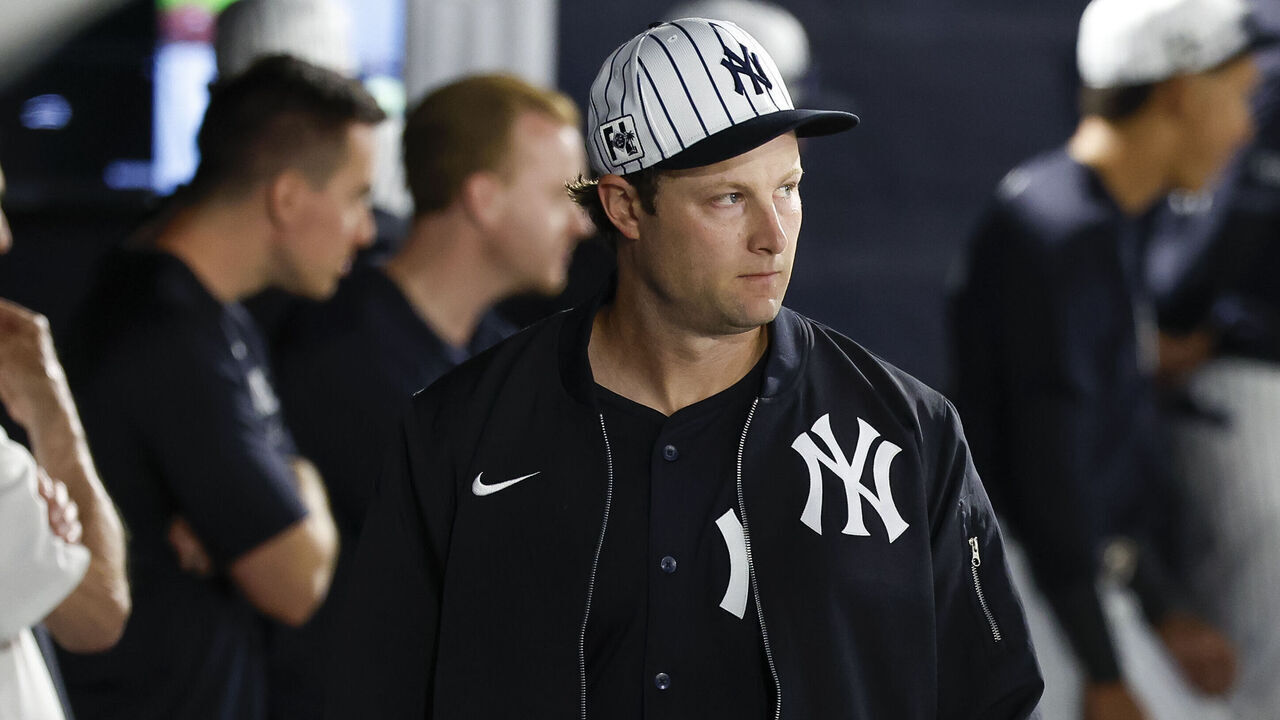 TAMPA, FLORIDA - FEBRUARY 28: Gerrit Cole #45 of the New York Yankees walks through the dugout in the first inning during a spring training game against the Toronto Blue Jays at George M. Steinbrenner Field on February 28, 2025 in Tampa, Florida.