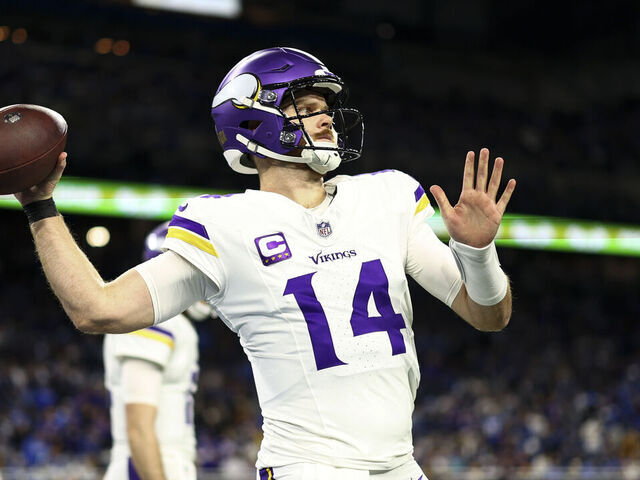 DETROIT, MICHIGAN - JANUARY 5: Sam Darnold #14 of the Minnesota Vikings warms up prior to an NFL football game against the Detroit Lions at Ford Field on January 5, 2025 in Detroit, Michigan.