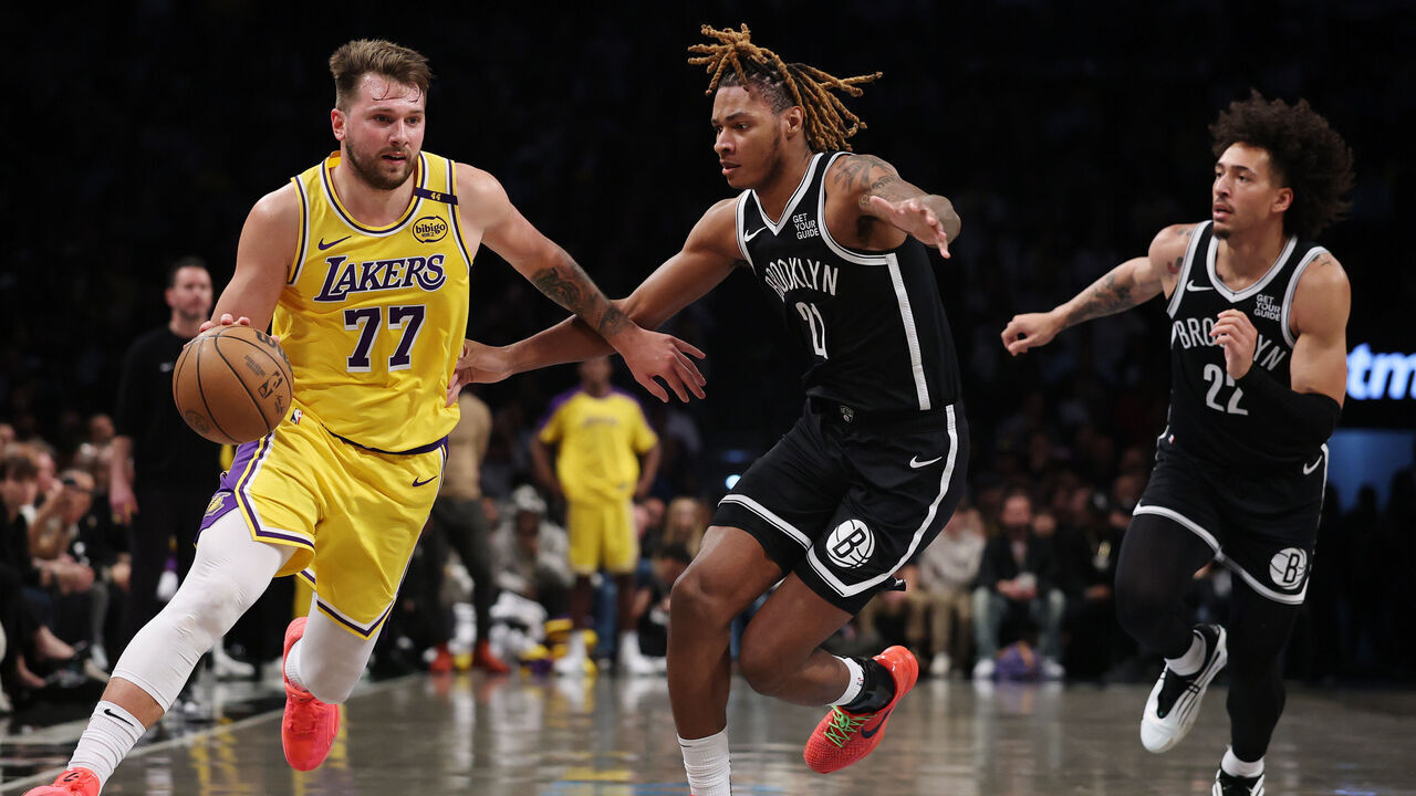 n Luka Doncic #77 of the Los Angeles Lakers dribbles as Noah Clowney #21 and Jalen Wilson #22 of the Brooklyn Nets defend during the second half at Barclays Center on March 10, 2025 in the Brooklyn borough of New York City. The Nets won 111-108.