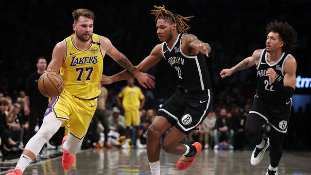 n Luka Doncic #77 of the Los Angeles Lakers dribbles as Noah Clowney #21 and Jalen Wilson #22 of the Brooklyn Nets defend during the second half at Barclays Center on March 10, 2025 in the Brooklyn borough of New York City. The Nets won 111-108.