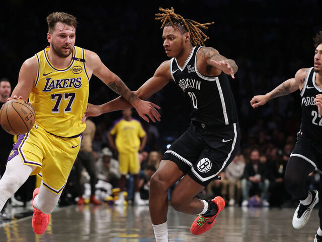 n Luka Doncic #77 of the Los Angeles Lakers dribbles as Noah Clowney #21 and Jalen Wilson #22 of the Brooklyn Nets defend during the second half at Barclays Center on March 10, 2025 in the Brooklyn borough of New York City. The Nets won 111-108.