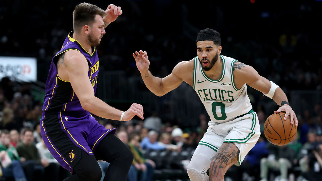 BOSTON, MASSACHUSETTS - MARCH 08: Jayson Tatum #0 of the Boston Celtics looks for the open lane as Luka Doncic #77 of the Los Angeles Lakers defends during the second half at TD Garden on March 08, 2025 in Boston, Massachusetts. The Boston Celtics defeated the Los Angeles Lakers 111-101.