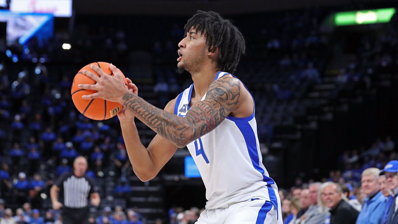 MEMPHIS, TENNESSEE - FEBRUARY 09: PJ Haggerty #4 of the Memphis Tigers takes a shot during the game against the Temple Owls at FedExForum on February 09, 2025 in Memphis, Tennessee.