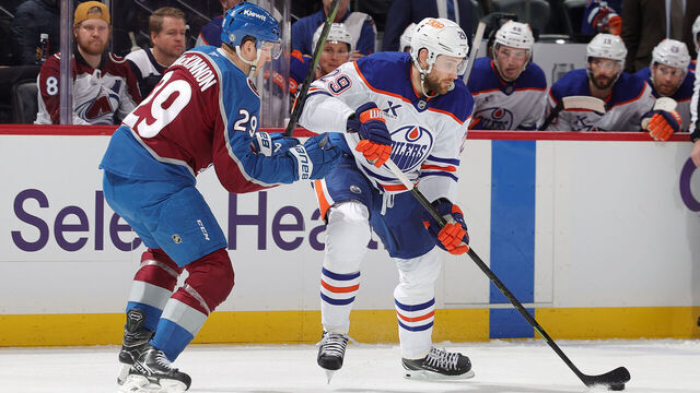 DENVER, COLORADO - JANUARY 16: Nathan MacKinnon #29 of the Colorado Avalanche skates against Leon Draisaitl #29 of the Edmonton Oilers at Ball Arena on January 16, 2025 in Denver, Colorado.