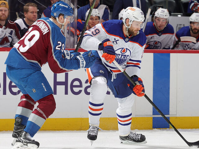 DENVER, COLORADO - JANUARY 16: Nathan MacKinnon #29 of the Colorado Avalanche skates against Leon Draisaitl #29 of the Edmonton Oilers at Ball Arena on January 16, 2025 in Denver, Colorado.