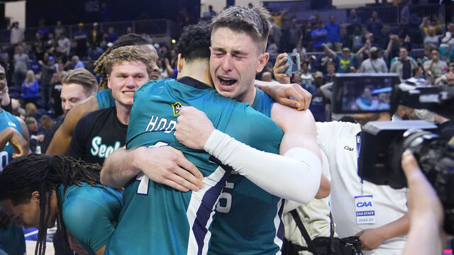 WASHINGTON, DC - MARCH 11: UNC Wilmington Seahawks Guard Noah Ross (5) shows emotion hugging teammate UNC Wilmington Seahawks Guard Nolan Hodge (4) after winning the CAA Men's Basketball Championship Game between the Delaware Blue Hens and the UNC Wilmington Seahawks on March 11, 2025 at the CareFirst Arena in Washington DC.