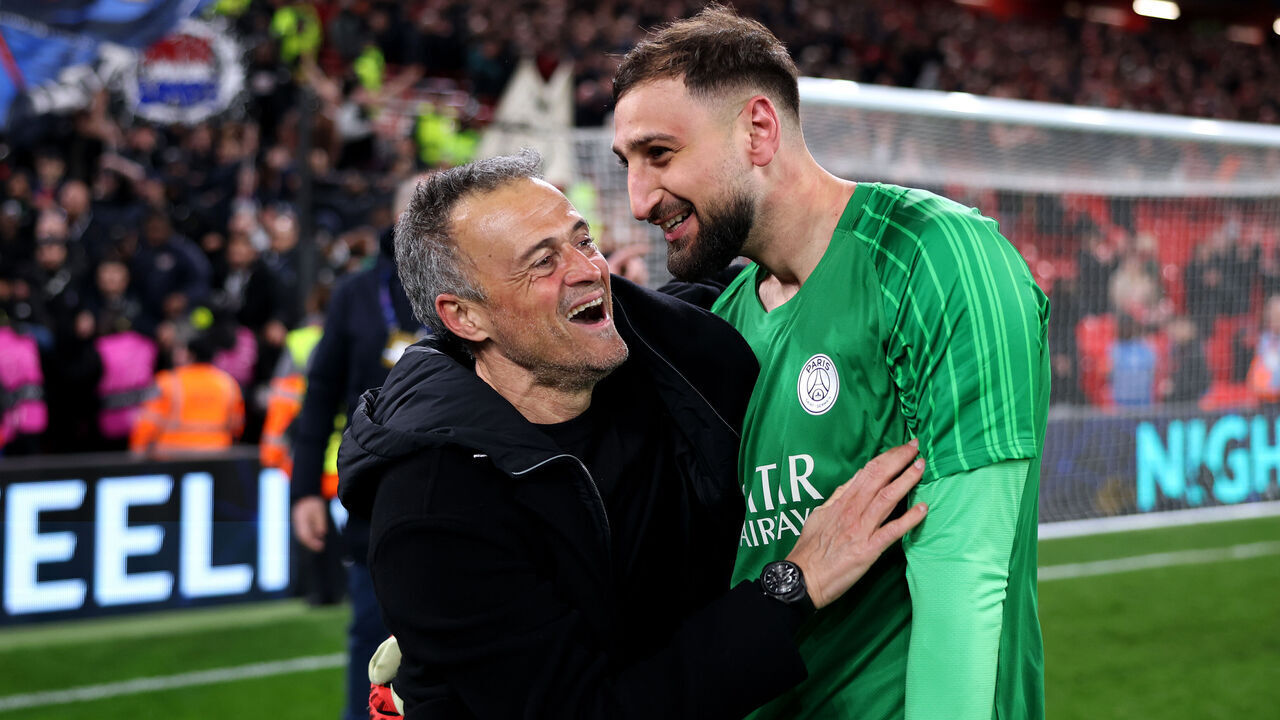 LIVERPOOL, ENGLAND - MARCH 11: Luis Enrique, Head Coach of Paris Saint-Germain, and Gianluigi Donnarumma of Paris Saint-Germain celebrate after the team's victory in the UEFA Champions League 2024/25 Round of 16 Second Leg match between Liverpool FC and Paris Saint-Germain at Anfield on March 11, 2025 in Liverpool, England.
