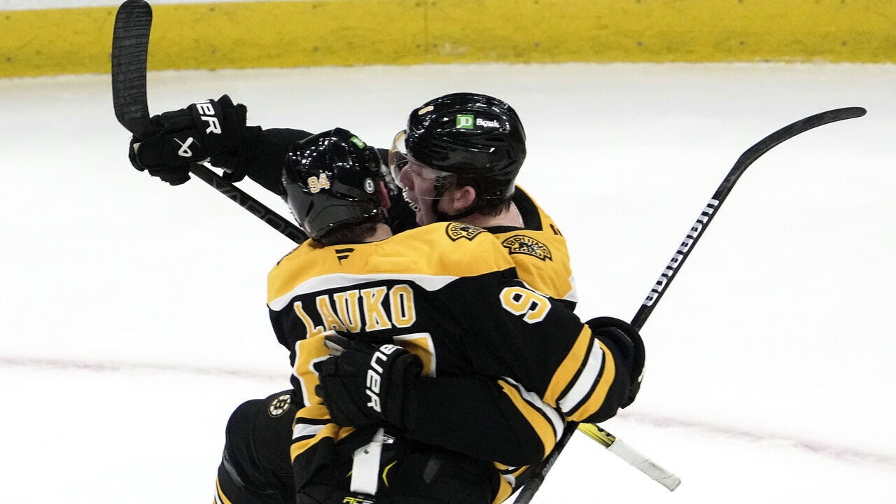 Boston, MA - March 11: Boston Bruins C Jakub Lauko and D Mason Lohrei celebrate the game-tying goal in the third period.