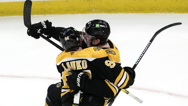 Boston, MA - March 11: Boston Bruins C Jakub Lauko and D Mason Lohrei celebrate the game-tying goal in the third period.
