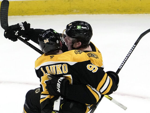 Boston, MA - March 11: Boston Bruins C Jakub Lauko and D Mason Lohrei celebrate the game-tying goal in the third period.