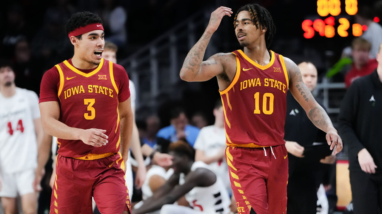CINCINNATI, OHIO - FEBRUARY 13: Tamin Lipsey #3 and Keshon Gilbert #10 of the Iowa State Cyclones celebrate after beating the Cincinnati Bearcats 68-59 at Fifth Third Arena on February 13, 2024 in Cincinnati, Ohio.