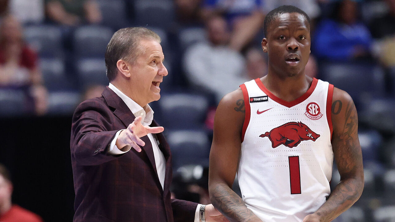 NASHVILLE, TENNESSEE - MARCH 12: John Calipari the head coach of the Arkansas Razorbacks gives instructions to Johnell Davis #1 against the South Carolina Gamecocks during the SEC Men's Basketball Tournament - First Round at Bridgestone Arena on March 12, 2025 in Nashville, Tennessee.