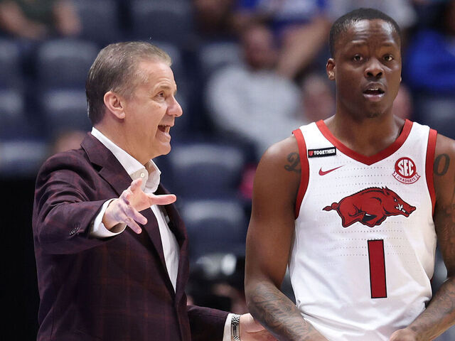 NASHVILLE, TENNESSEE - MARCH 12: John Calipari the head coach of the Arkansas Razorbacks gives instructions to Johnell Davis #1 against the South Carolina Gamecocks during the SEC Men's Basketball Tournament - First Round at Bridgestone Arena on March 12, 2025 in Nashville, Tennessee.
