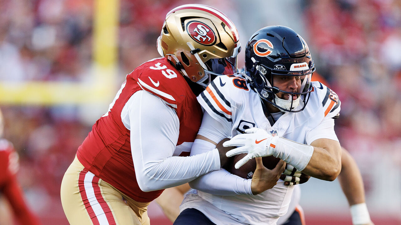 SANTA CLARA, CALIFORNIA - DECEMBER 8: Quarterback Caleb Williams #18 of the Chicago Bears is sacked by defensive tackle Maliek Collins #99 of the San Francisco 49ers during the first half of an NFL football game, at Levi's Stadium on December 8, 2024 in Santa Clara, California.