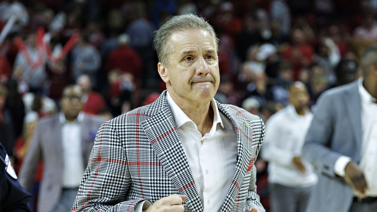 FAYETTEVILLE, ARKANSAS - MARCH 08: Head Coach John Calipari of the Arkansas Razorbacks jogs off the court after a game against the Mississippi State Bulldogs at Bud Walton Arena on March 08, 2025 in Fayetteville, Arkansas. The Razorbacks defeated the Bulldogs 93-92.