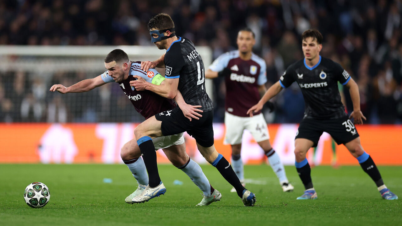 BIRMINGHAM, ENGLAND - MARCH 12: John McGinn of Aston Villa is challenged by Brandon Mechele of Club Brugge KV during the UEFA Champions League 2024/25 Round of 16 Second Leg match between Aston Villa FC and Club Brugge KV at Villa Park on March 12, 2025 in Birmingham, England.