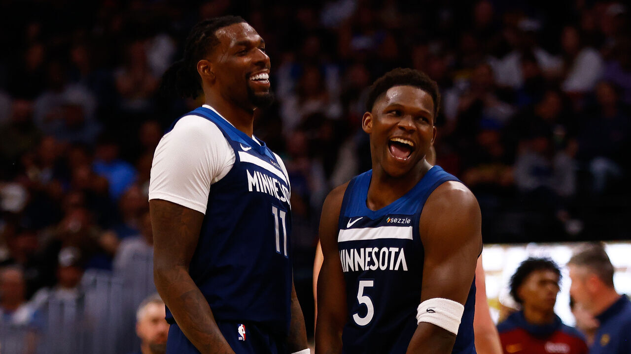 DENVER, CO - MARCH 12: Naz Reid #11 of the Minnesota Timberwolves celebrates his three point basket with Anthony Edwards #5 during the fourth quarter against the Denver Nuggets at Ball Arena on March 12, 2025 in Denver, Colorado.