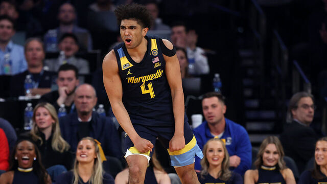 NEW YORK, NEW YORK - MARCH 13: Stevie Mitchell #4 of the Marquette Golden Eagles reacts in the second half of a quarterfinal game against the Xavier Musketeers during the Big East Men's Basketball Tournament at Madison Square Garden on March 13, 2025 in New York City. The Golden Eagles won 89-87.