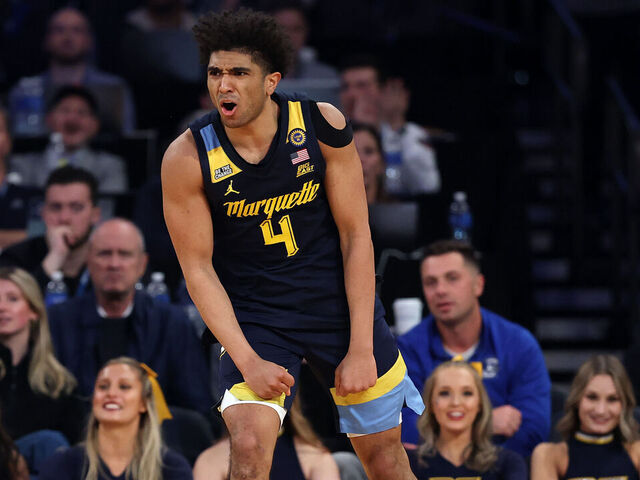 NEW YORK, NEW YORK - MARCH 13: Stevie Mitchell #4 of the Marquette Golden Eagles reacts in the second half of a quarterfinal game against the Xavier Musketeers during the Big East Men's Basketball Tournament at Madison Square Garden on March 13, 2025 in New York City. The Golden Eagles won 89-87.