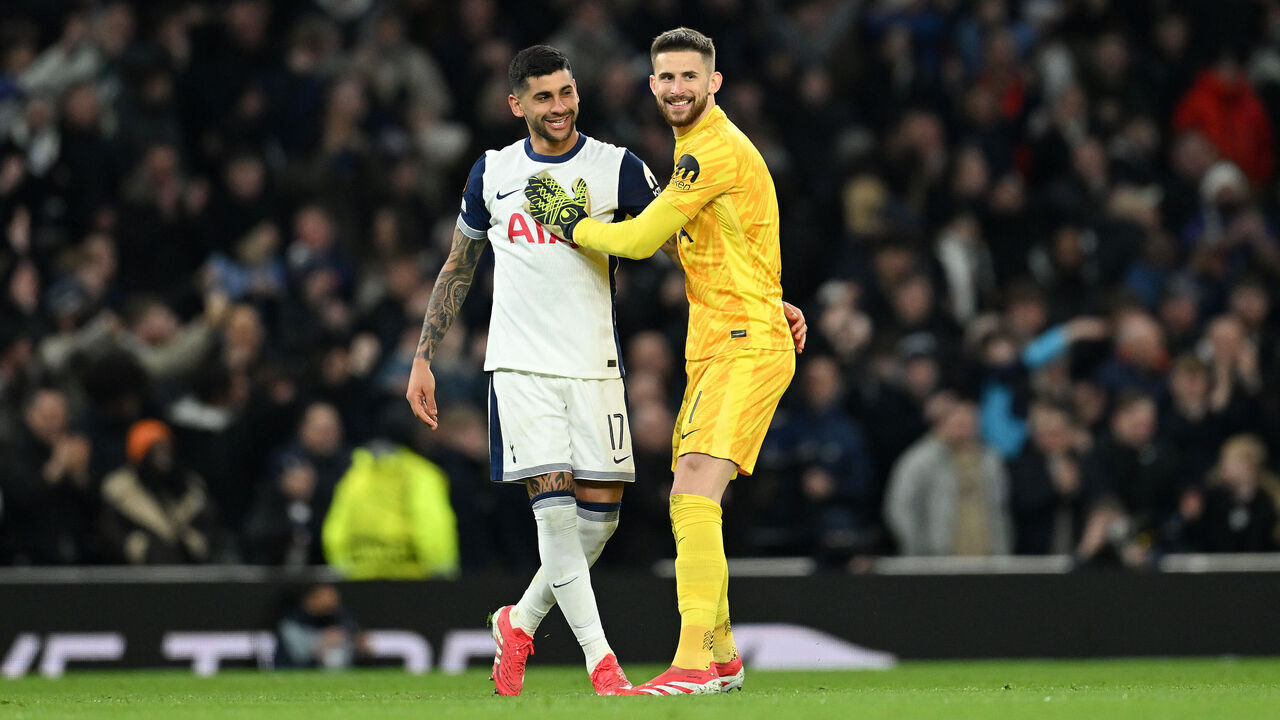 LONDON, ENGLAND - MARCH 13: Guglielmo Vicario and Cristian Romero of Tottenham Hotspur celebrate after teammate James Maddison (not pictured) scores his team's second goal during the UEFA Europa League 2024/25 Round of 16 Second Leg match between Tottenham Hotspur and AZ Alkmaar at Tottenham Hotspur Stadium on March 13, 2025 in London, England.