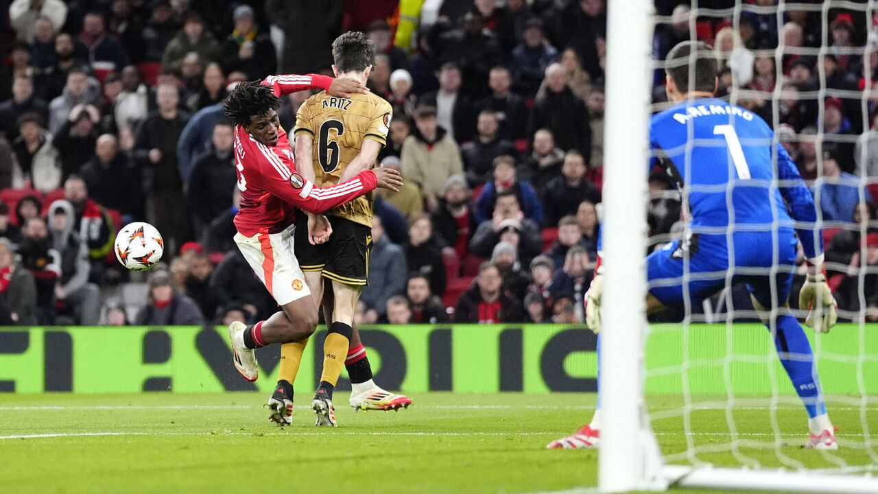 Manchester United's Patrick Dorgu (left) is fouled by Real Sociedad's Aritz Elustondo for a penalty during the UEFA Europa League round of sixteen second leg match at Old Trafford, Manchester. Picture date: Thursday March 13, 2025.