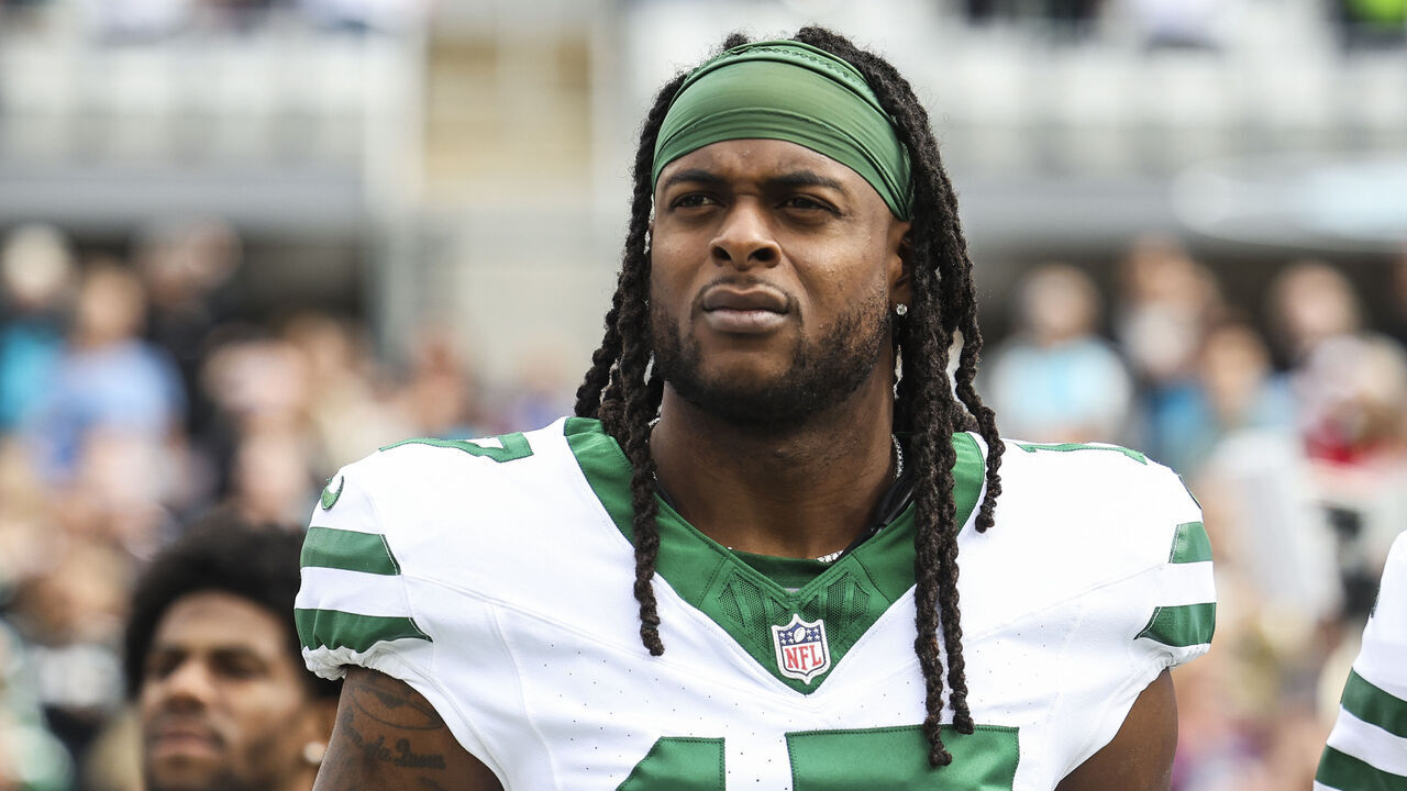JACKSONVILLE, FLORIDA - DECEMBER 15: Davante Adams #17 of the New York Jets looks on from the sideline during the national anthem prior to an NFL football game against the Jacksonville Jaguars at EverBank Stadium on December 15, 2024 in Jacksonville, FL.