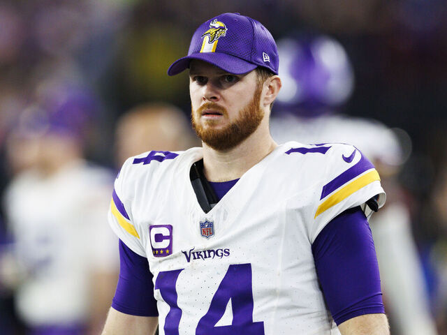 GLENDALE, ARIZONA - JANUARY 13: Sam Darnold #14 of the Minnesota Vikings on the sideline during the second half of the NFC Wild Card Playoff game against the Los Angeles Rams at State Farm Stadium on January 13, 2025 in Glendale, Arizona.
