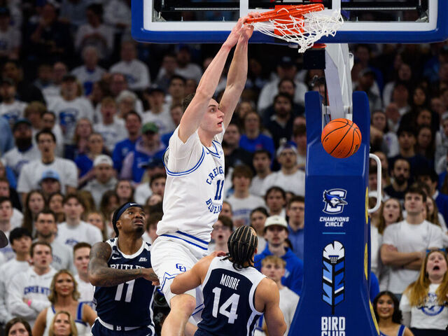 OMAHA, NE - MARCH 08: Creighton Bluejays center Ryan Kalkbrenner (11) goes up for a dunk during the men's college basketball game between the Butler Bulldogs and Creighton Bluejays on March 8, 2025, at the CHI Health Center in Omaha, NE.