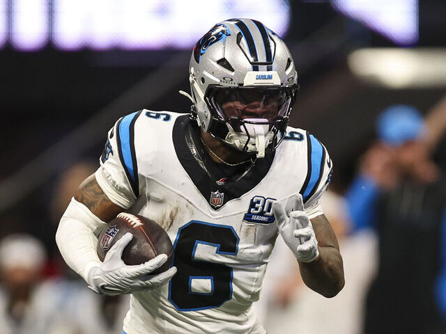 ATLANTA, GEORGIA - JANUARY 05: Miles Sanders #6 of the Carolina Panthers runs the ball during an NFL football game against the Atlanta Falcons at Mercedes-Benz Stadium on January 5, 2025 in Atlanta, Georgia.