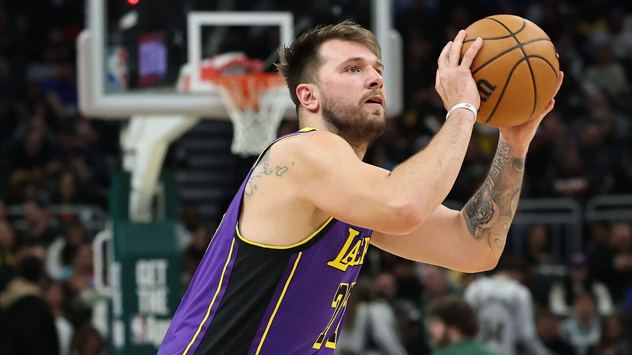 MILWAUKEE, WISCONSIN - MARCH 13: Luka Doncic #77 of the Los Angeles Lakers takes a three point shot during a game against the Milwaukee Bucks at Fiserv Forum on March 13, 2025 in Milwaukee, Wisconsin.