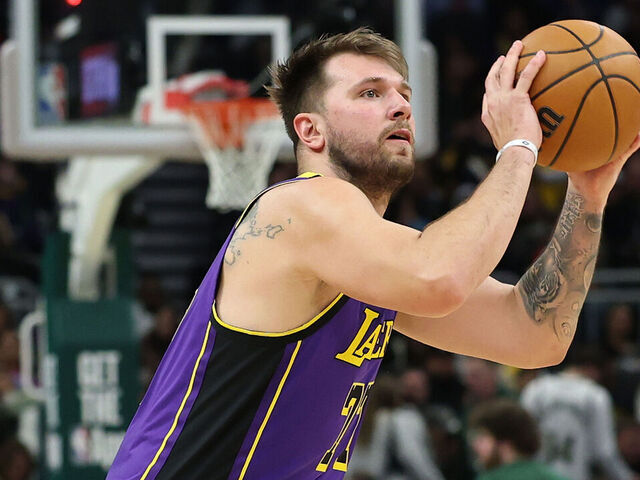 MILWAUKEE, WISCONSIN - MARCH 13: Luka Doncic #77 of the Los Angeles Lakers takes a three point shot during a game against the Milwaukee Bucks at Fiserv Forum on March 13, 2025 in Milwaukee, Wisconsin.