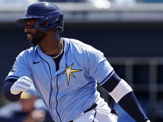 PORT CHARLOTTE, FL - MARCH 13: Tampa Bay Rays first baseman Yandy Díaz (2) singles to right field to drive in two runs in the fourth inning during an MLB Spring Training baseball game against the Washington Nationals on March 13, 2025 at Charlotte Sports Park in Port Charlotte, Florida.