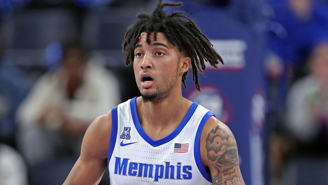 MEMPHIS, TENNESSEE - FEBRUARY 09: PJ Haggerty #4 of the Memphis Tigers brings the ball up court during the game against the Temple Owls at FedExForum on February 09, 2025 in Memphis, Tennessee.
