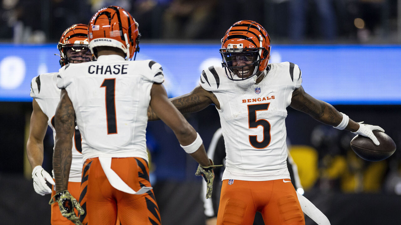 INGLEWOOD, CALIFORNIA - NOVEMBER 17: Tee Higgins #5 of the Cincinnati Bengals celebrates with teammates after scoring a touchdown during an NFL Football game against the Los Angeles Chargers at SoFi Stadium on November 17, 2024 in Inglewood, California.